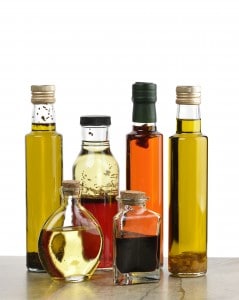 Glass Bottles Of Olive Oil,Salad Dressing And Vinegar